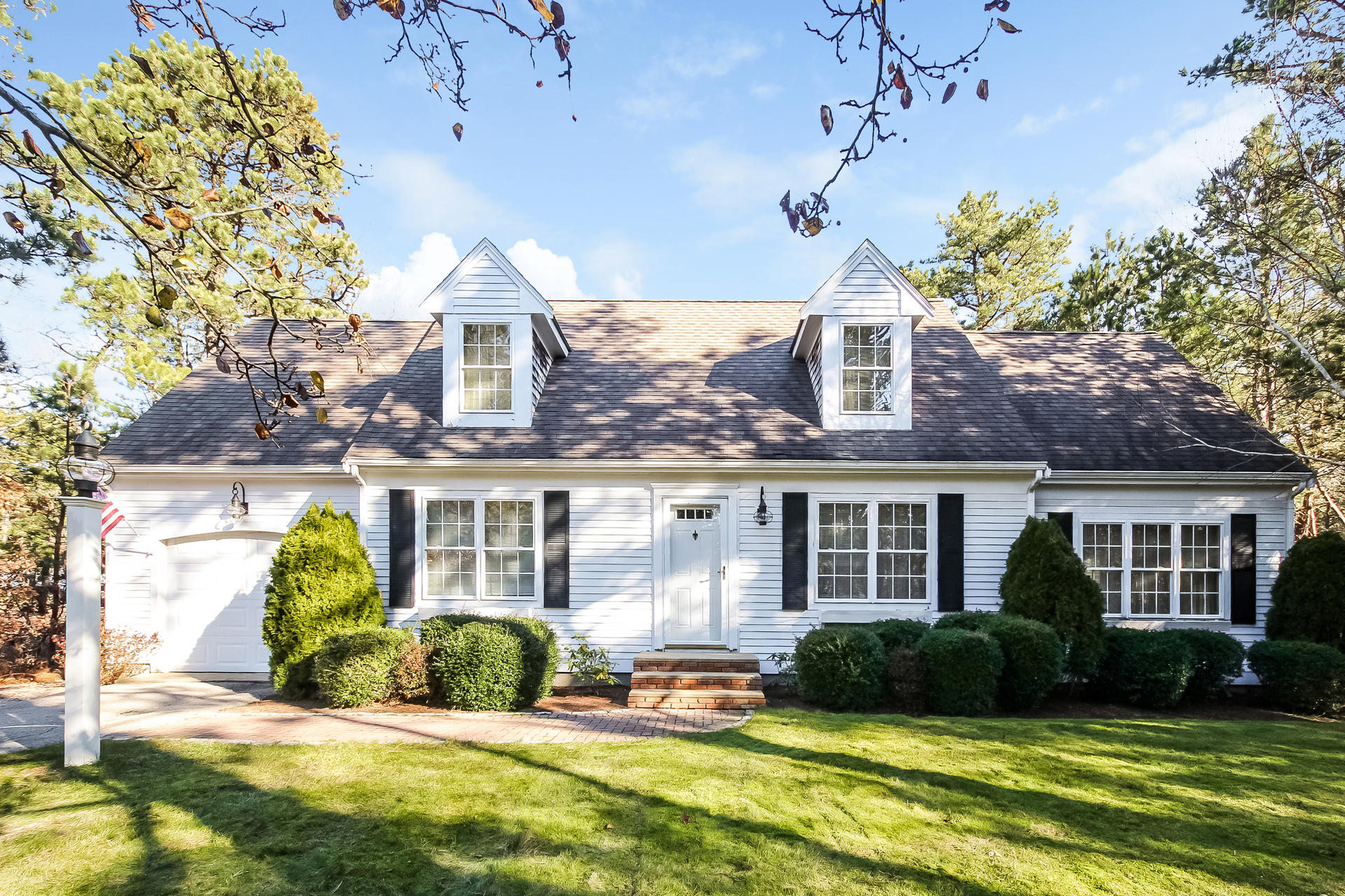 9 Wintergreen Road Mashpee, MA 02649 - Photo 2 of 24 a view of a house with a swimming pool