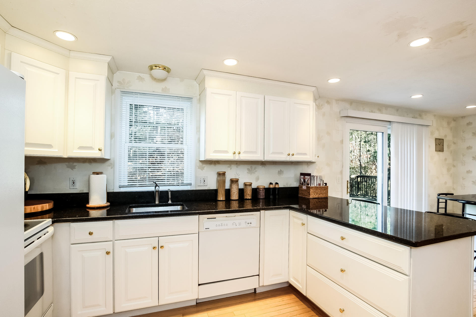 9 Wintergreen Road Mashpee, MA 02649 - Photo 5 of 24 a kitchen with granite countertop a sink and cabinets