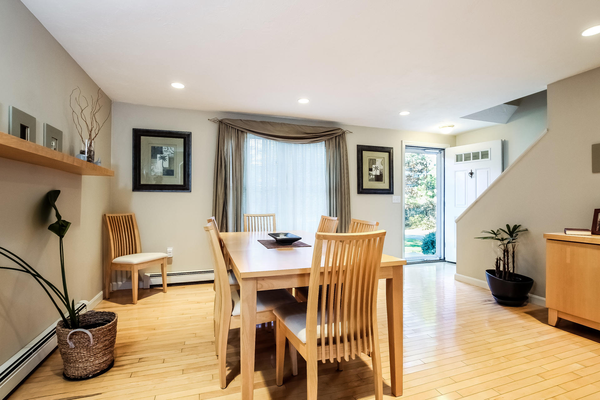 9 Wintergreen Road Mashpee, MA 02649 - Photo 6 of 24 a view of a dining room with furniture and wooden floor