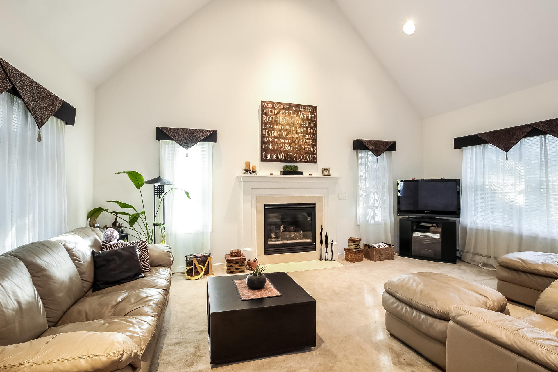9 Wintergreen Road Mashpee, MA 02649 - Photo 8 of 24 a living room with furniture a fireplace and a flat screen tv