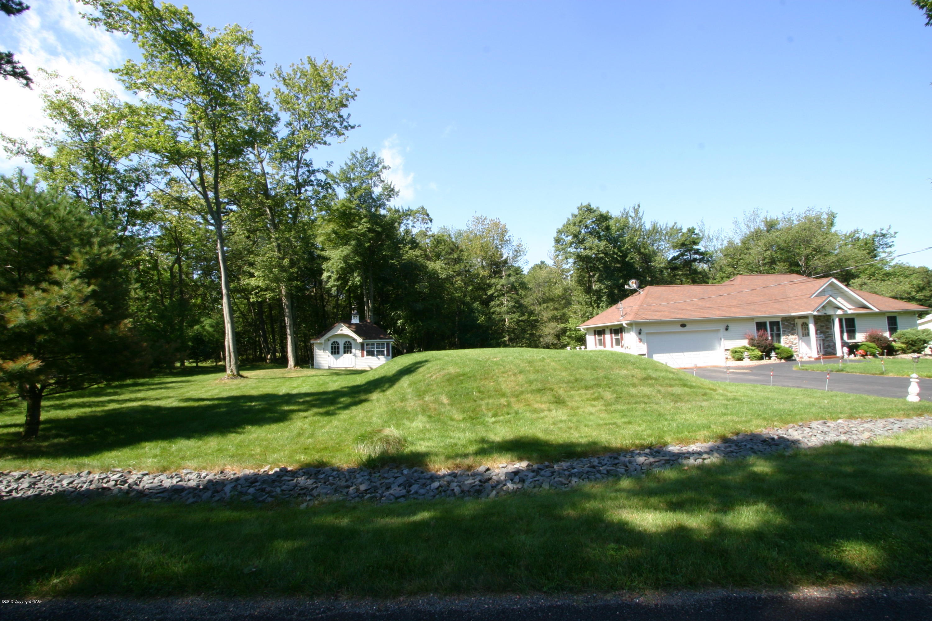 6293 Laurel Road Pocono Summit, PA 18346 - Photo 8 of 32 a view of a house with a yard
