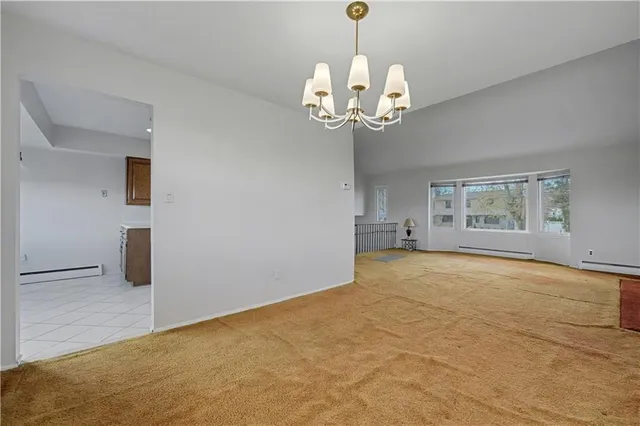 a view of an entryway with a chandelier