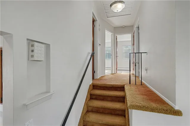 an empty room with a empty space and window