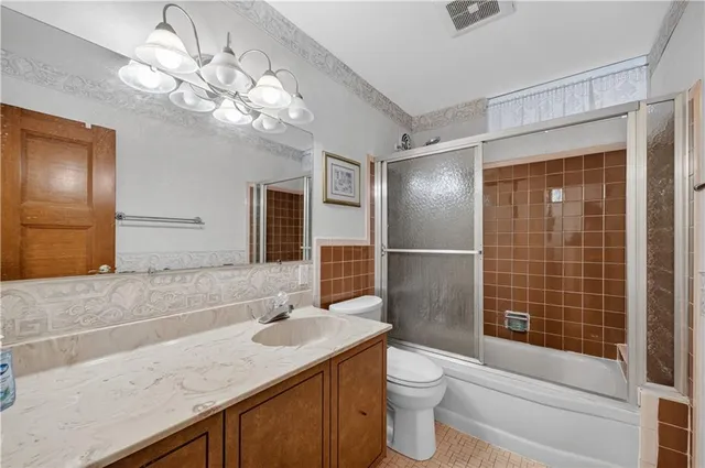 a view of a room with wooden floor and windows