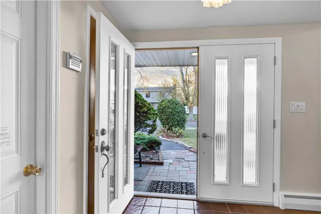 a view of a livingroom with furniture and staircase
