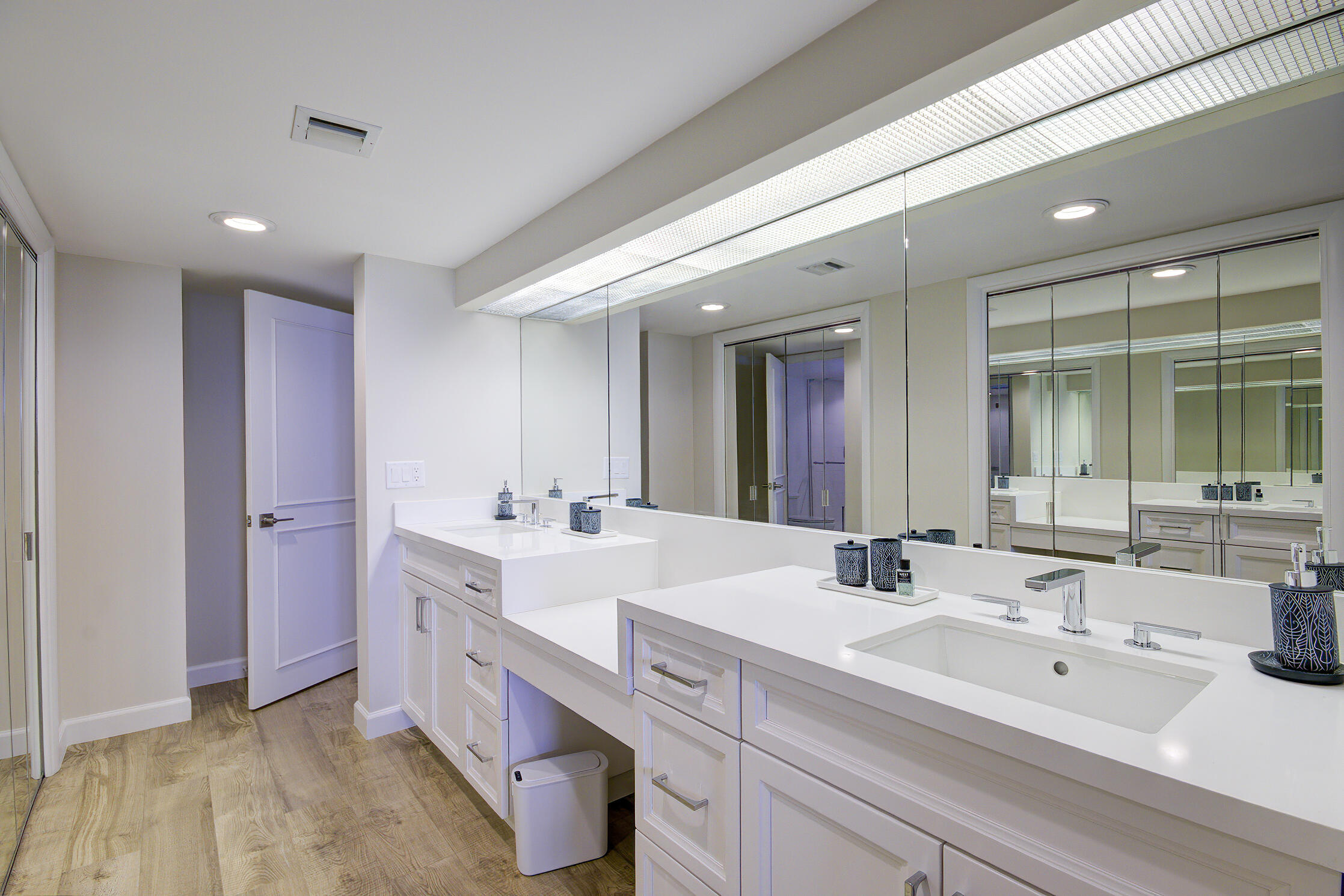 120 South Ocean Boulevard, Unit 4A Delray Beach, FL 33483 - Photo 18 of 36 a bathroom with a double vanity sink mirror and