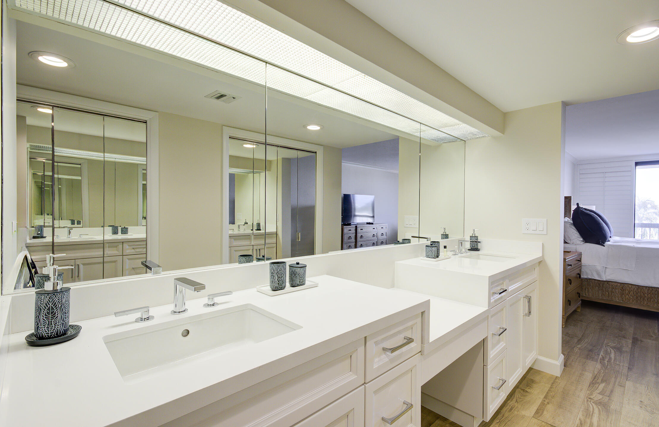 120 South Ocean Boulevard, Unit 4A Delray Beach, FL 33483 - Photo 19 of 36 a en suite bathroom with double vanity sinks and a mirror