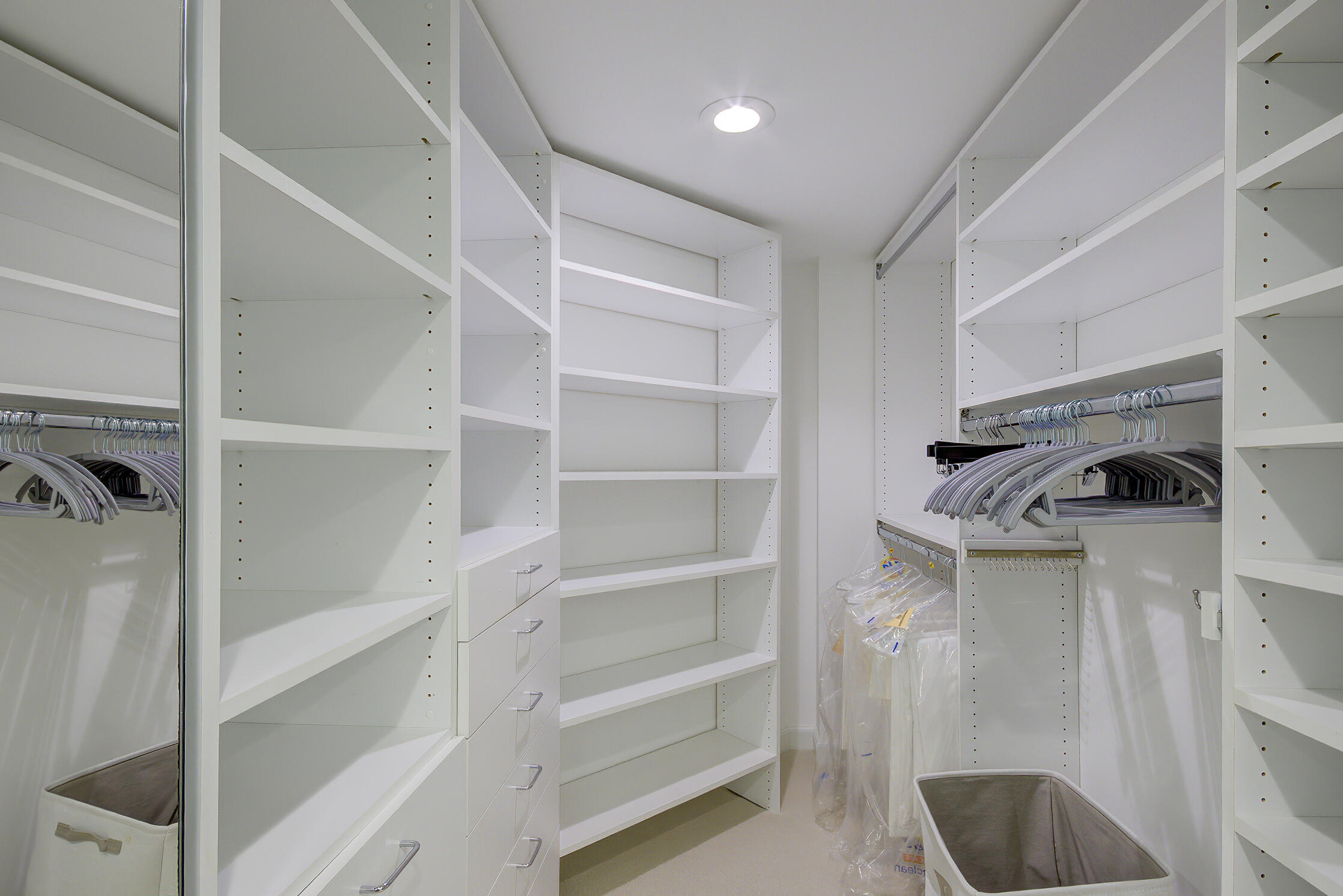 120 South Ocean Boulevard, Unit 4A Delray Beach, FL 33483 - Photo 22 of 36 a view of walk in closet with empty racks