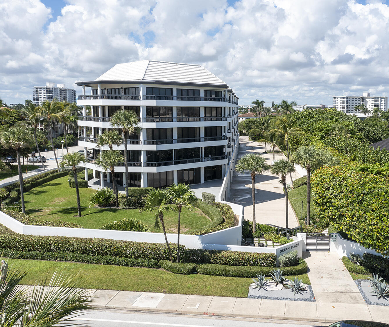 120 South Ocean Boulevard, Unit 4A Delray Beach, FL 33483 - Photo 27 of 36 a front view of a house with a yard