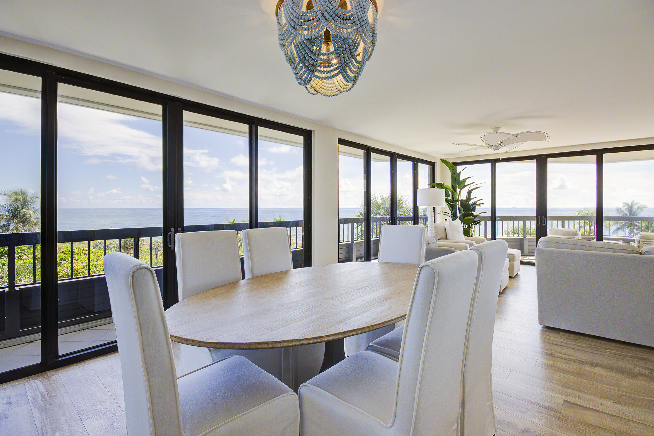120 South Ocean Boulevard, Unit 4A Delray Beach, FL 33483 - Photo 3 of 36 a view of a dining room with furniture and a large window