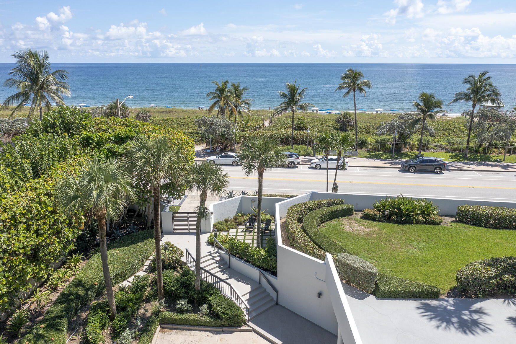 120 South Ocean Boulevard, Unit 4A Delray Beach, FL 33483 - Photo 36 of 36 a view of a swimming pool with a patio and garden