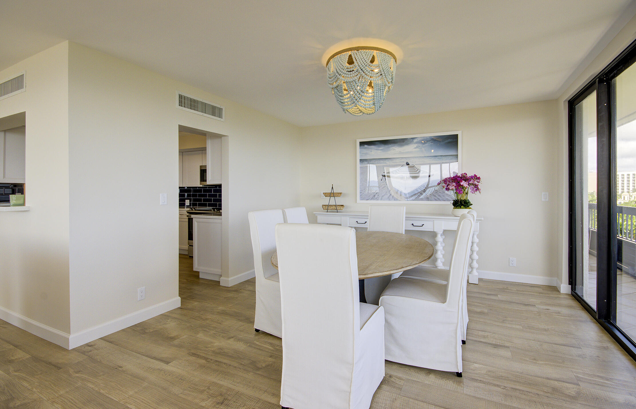 120 South Ocean Boulevard, Unit 4A Delray Beach, FL 33483 - Photo 7 of 36 a dining room with furniture and wooden floor