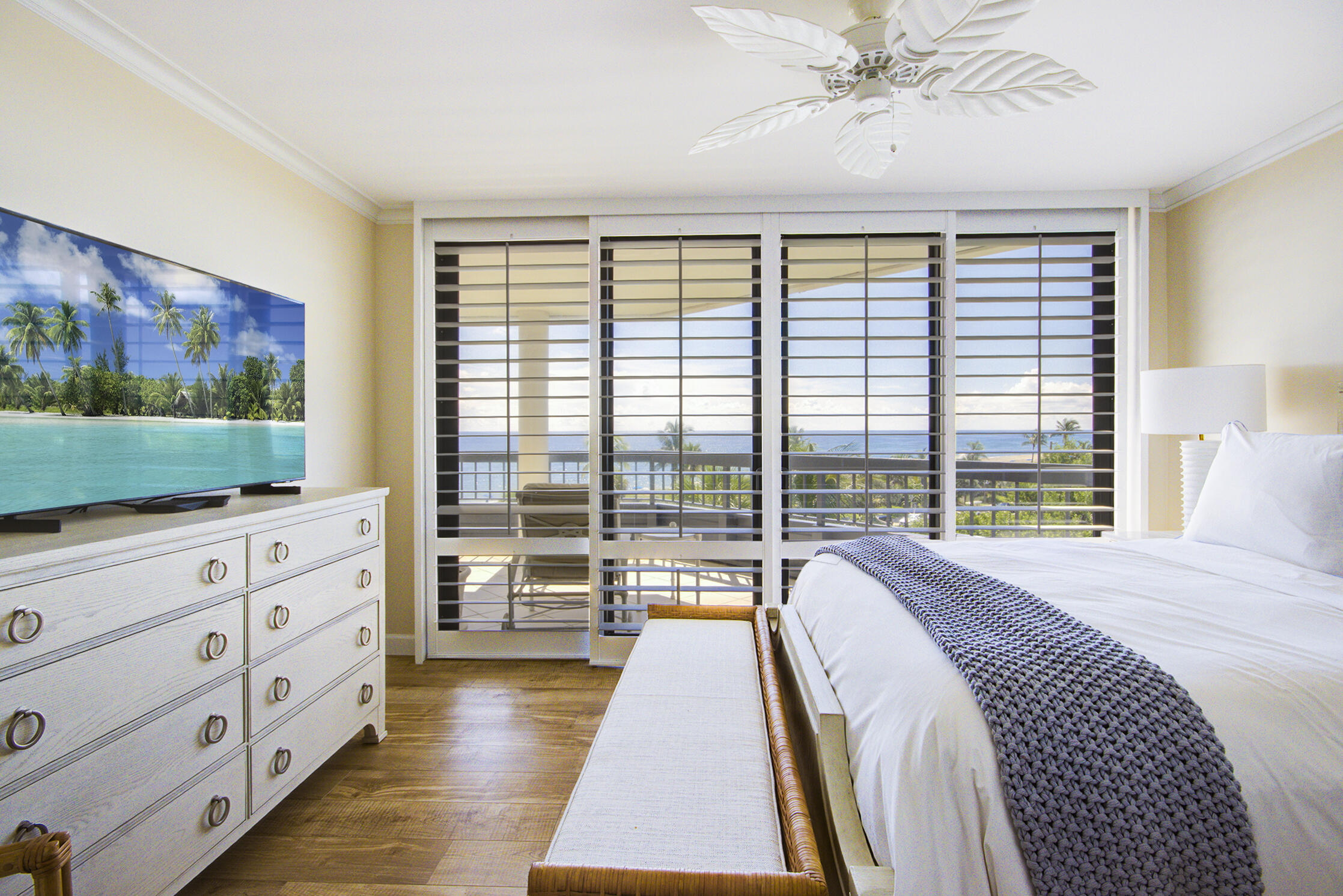 120 South Ocean Boulevard, Unit 4A Delray Beach, FL 33483 - Photo 10 of 36 a spacious bedroom with a large bed and a dresser