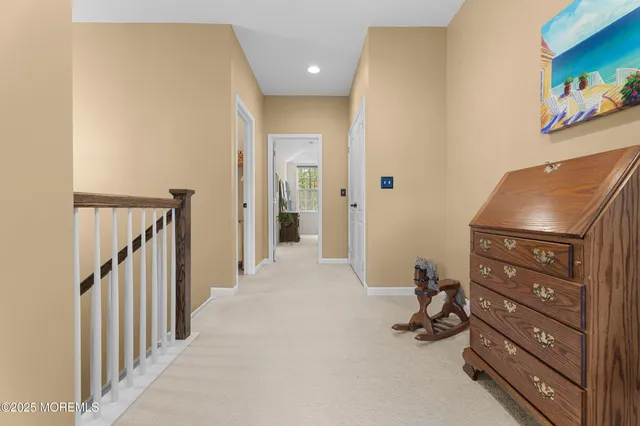 a living room with furniture a flat screen tv and a window