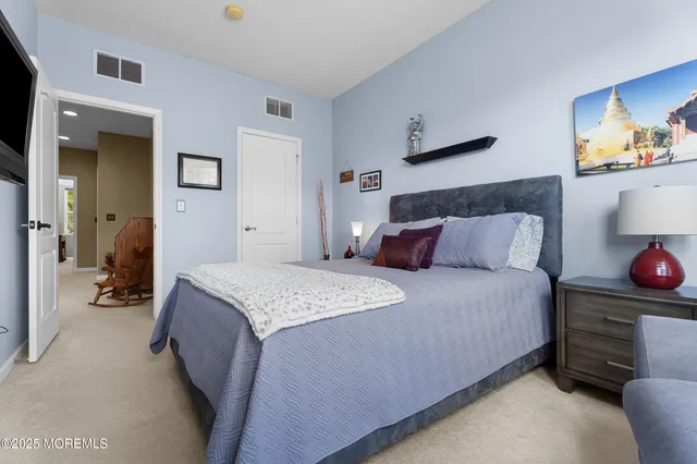 a bathroom with a sink mirror toilet and shower