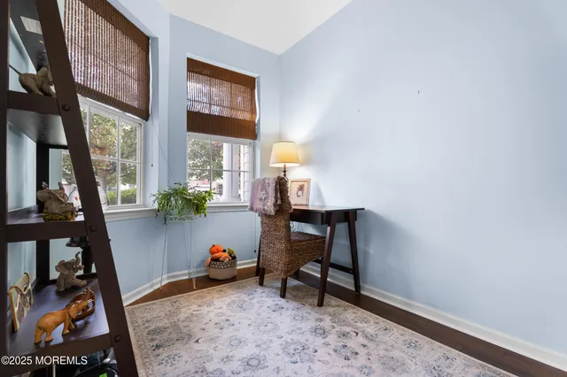 a bathroom with a sink a toilet and a shower curtain