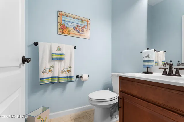 a view of living room with furniture and wooden floor