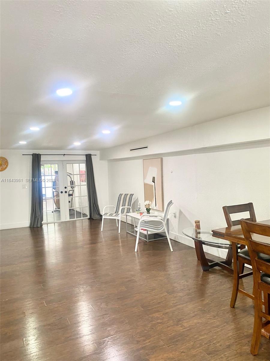 739 Northwest 112th Street Miami, FL 33168 - Photo 17 of 56 a view of a work space with wooden floor and furniture