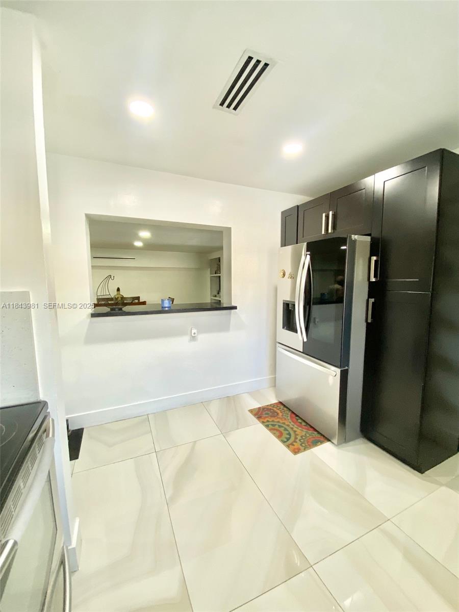 739 Northwest 112th Street Miami, FL 33168 - Photo 52 of 56 a bathroom with a bathtub and a shower