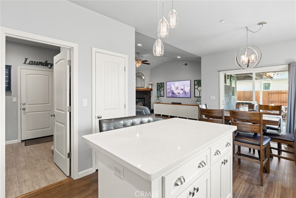 3465 Shaker Lane Chico, CA 95973 - Photo 11 of 34 a large kitchen with a table chairs refrigerator and a stove