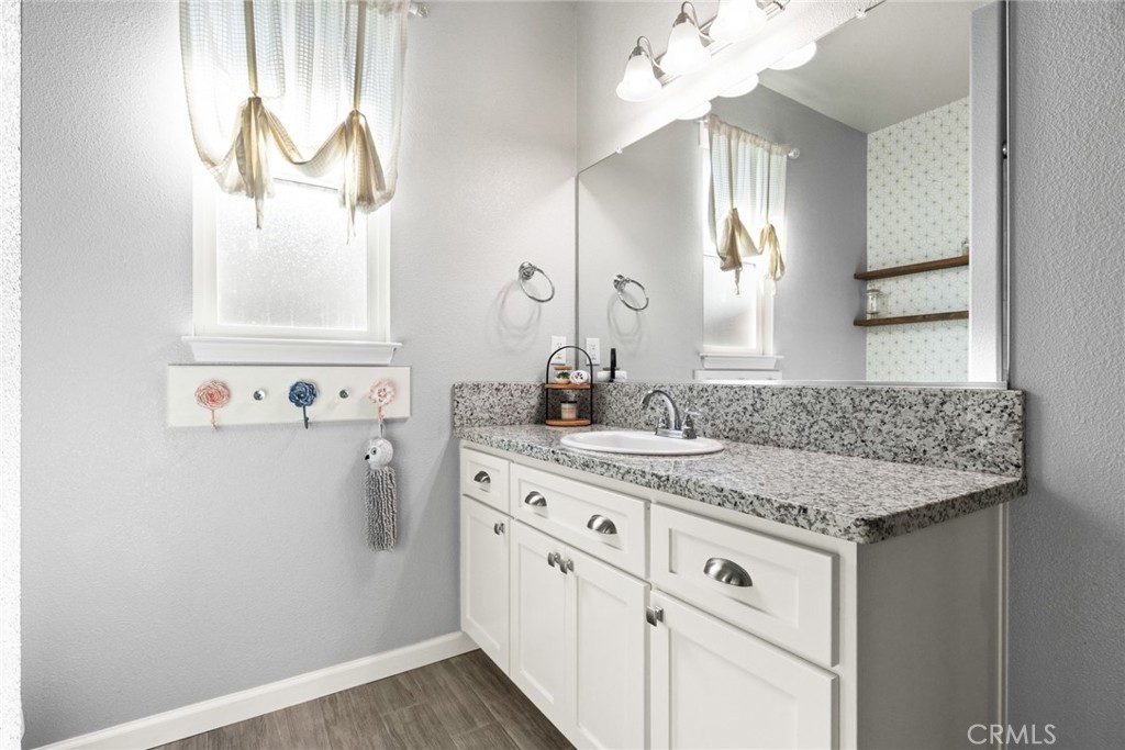 3465 Shaker Lane Chico, CA 95973 - Photo 16 of 34 a bathroom with a sink and a mirror