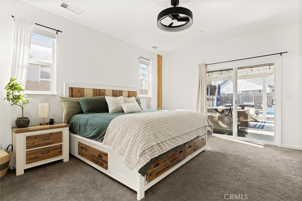 3465 Shaker Lane Chico, CA 95973 - Photo 17 of 34 a spacious bedroom with a bed and a large window