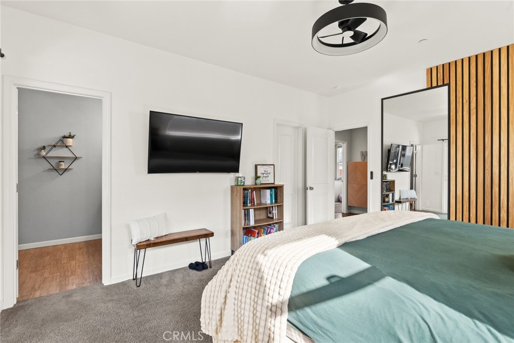 3465 Shaker Lane Chico, CA 95973 - Photo 18 of 34 a spacious bedroom with a bed and a flat screen tv