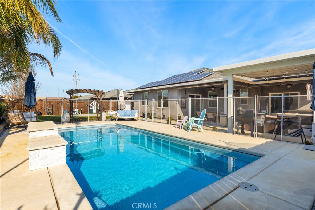 3465 Shaker Lane Chico, CA 95973 - Photo 20 of 34 a swimming pool with outdoor seating and yard