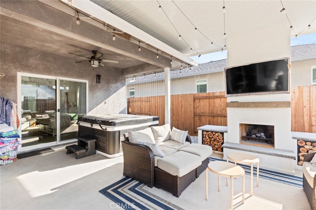 3465 Shaker Lane Chico, CA 95973 - Photo 27 of 34 a living room with furniture a flat screen tv and a fireplace