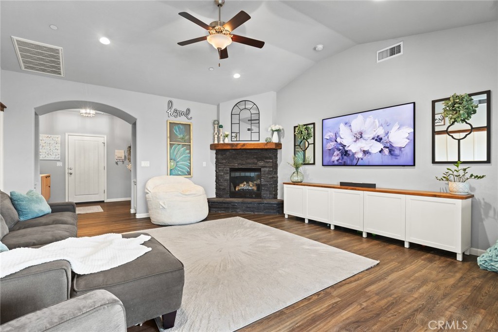 3465 Shaker Lane Chico, CA 95973 - Photo 5 of 34 a living room with furniture a fireplace and a chandelier