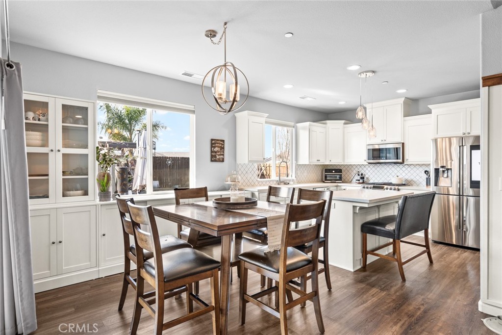 3465 Shaker Lane Chico, CA 95973 - Photo 7 of 34 a view of a dining room with furniture window and wooden floor