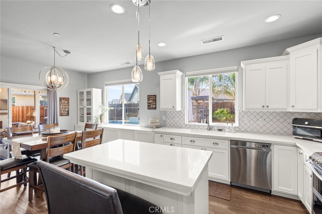 3465 Shaker Lane Chico, CA 95973 - Photo 9 of 34 a large white kitchen with a large window