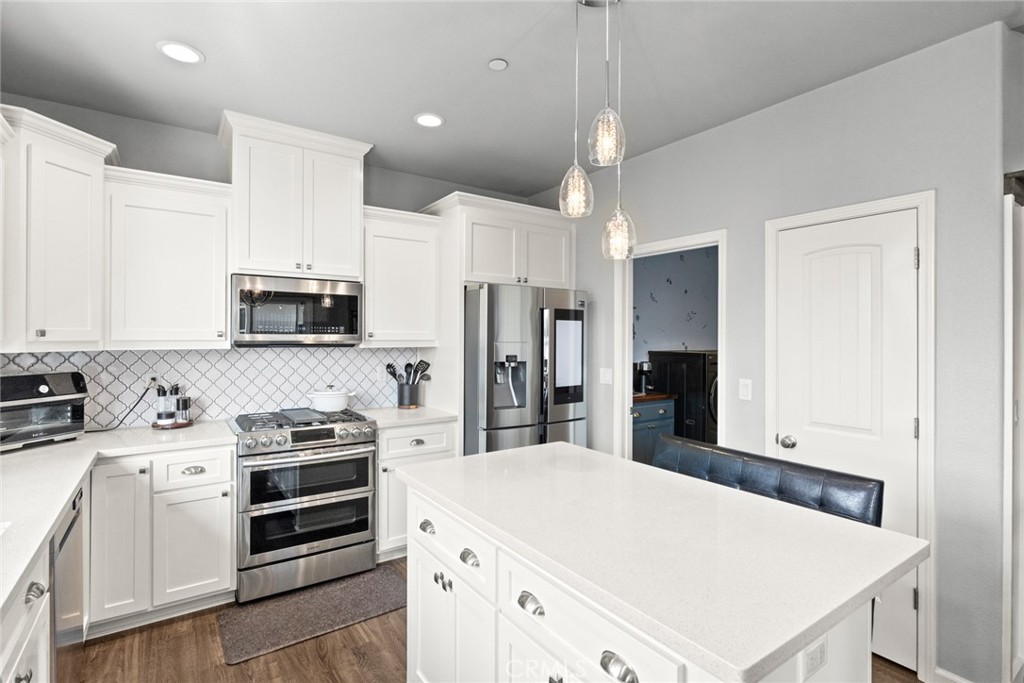 3465 Shaker Lane Chico, CA 95973 - Photo 10 of 34 a kitchen with stainless steel appliances a stove microwave and refrigerator