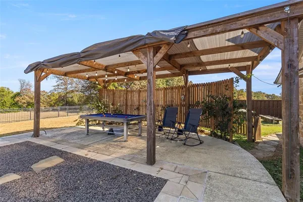 swimming pool view with a seating space