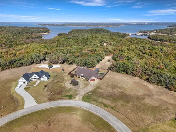 an aerial view of a house with outdoor space
