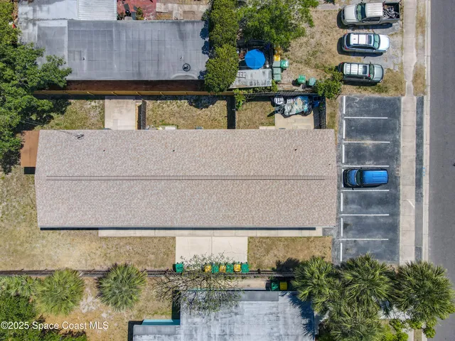 front view of a house with potted plants