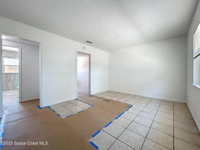 an empty room with windows