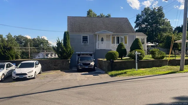 a front view of a house with garage