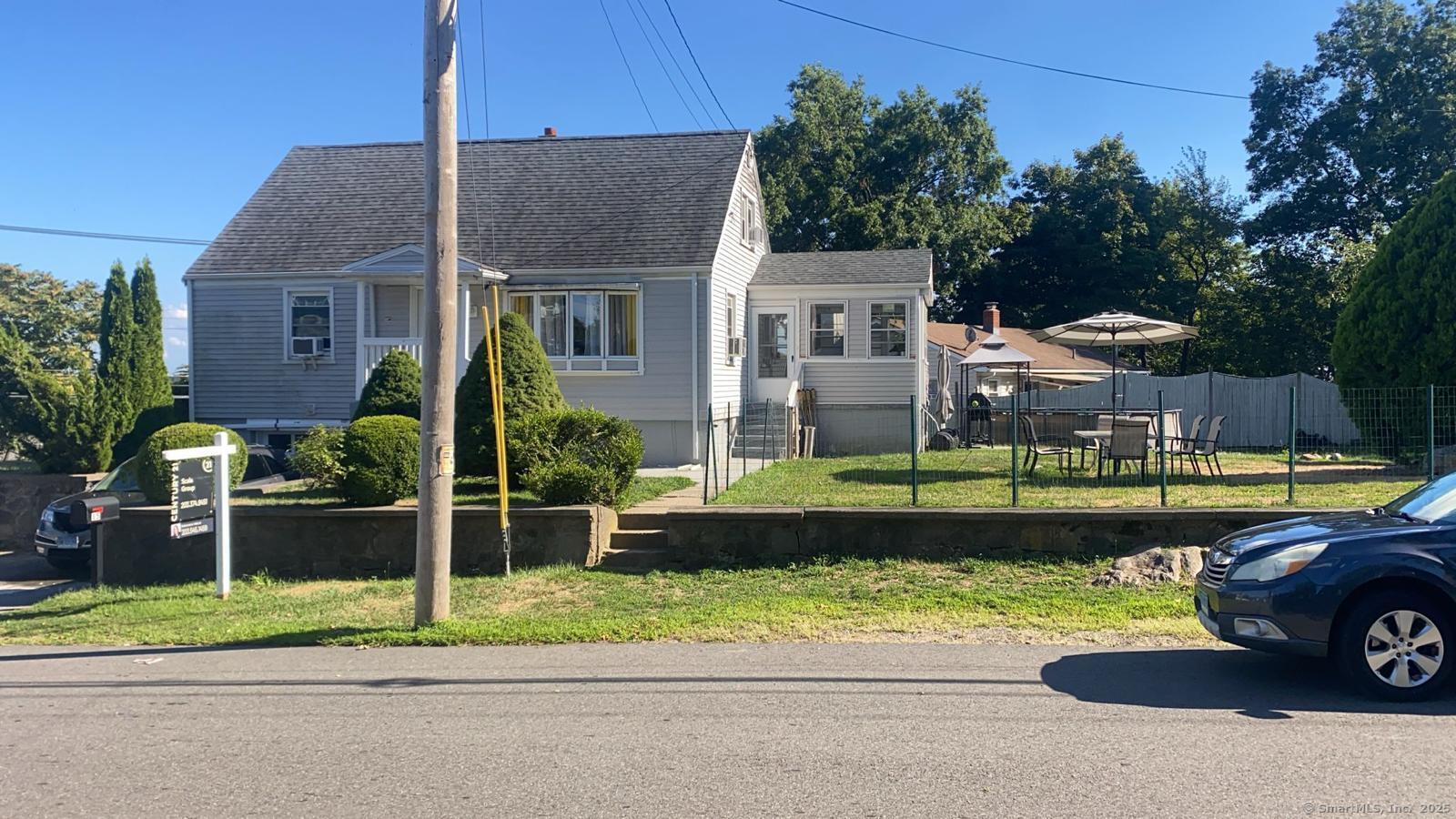 15 Edwards Street Bridgeport, CT 06606 - Photo 2 of 33 a front view of a house with a yard