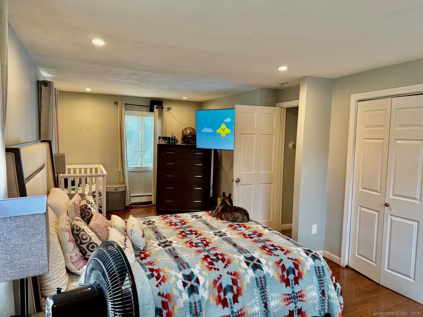 15 Edwards Street Bridgeport, CT 06606 - Photo 22 of 33 a bedroom with a bed and wooden floor