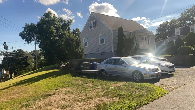 a bathroom with a sink a toilet and a shower curtain