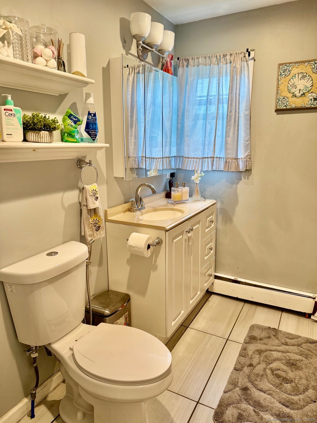 15 Edwards Street Bridgeport, CT 06606 - Photo 28 of 33 a bathroom with a sink a toilet and a shower curtain