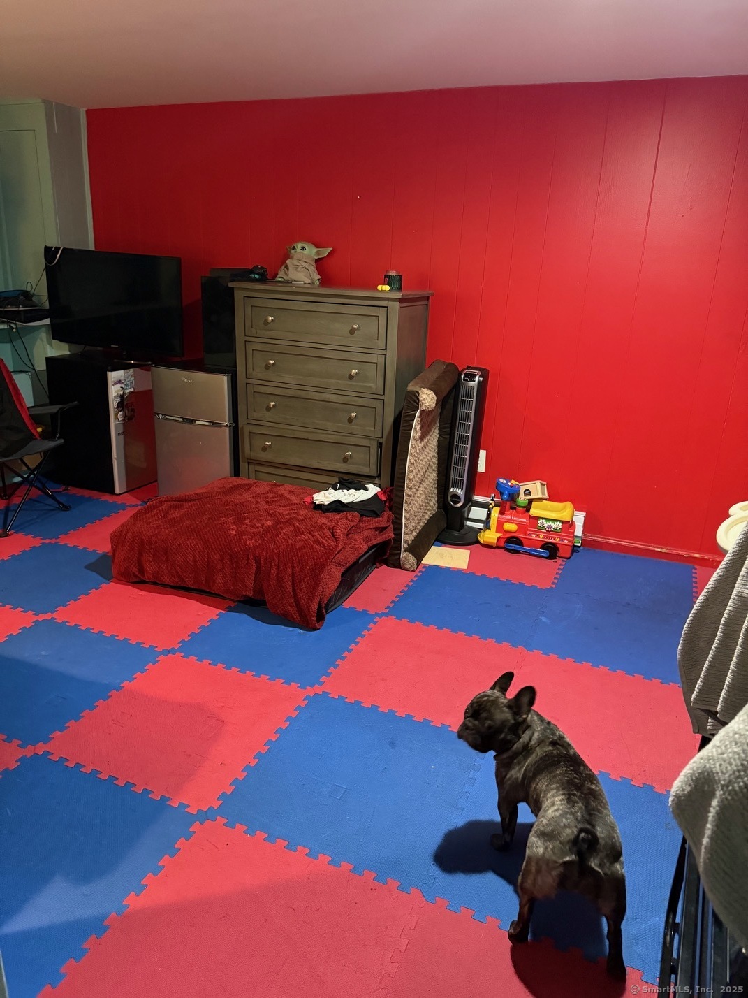 15 Edwards Street Bridgeport, CT 06606 - Photo 30 of 33 a bedroom with a bed and a flat screen tv