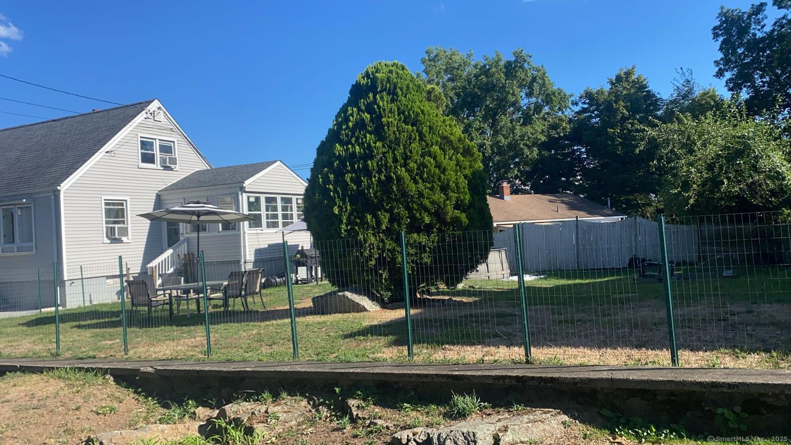 15 Edwards Street Bridgeport, CT 06606 - Photo 31 of 33 a view of a house with a yard
