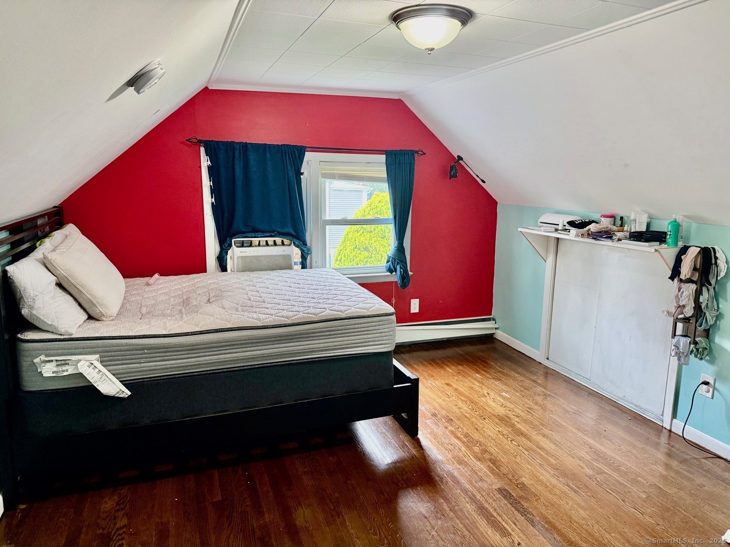 15 Edwards Street Bridgeport, CT 06606 - Photo 4 of 33 a bedroom with a bed and a potted plant