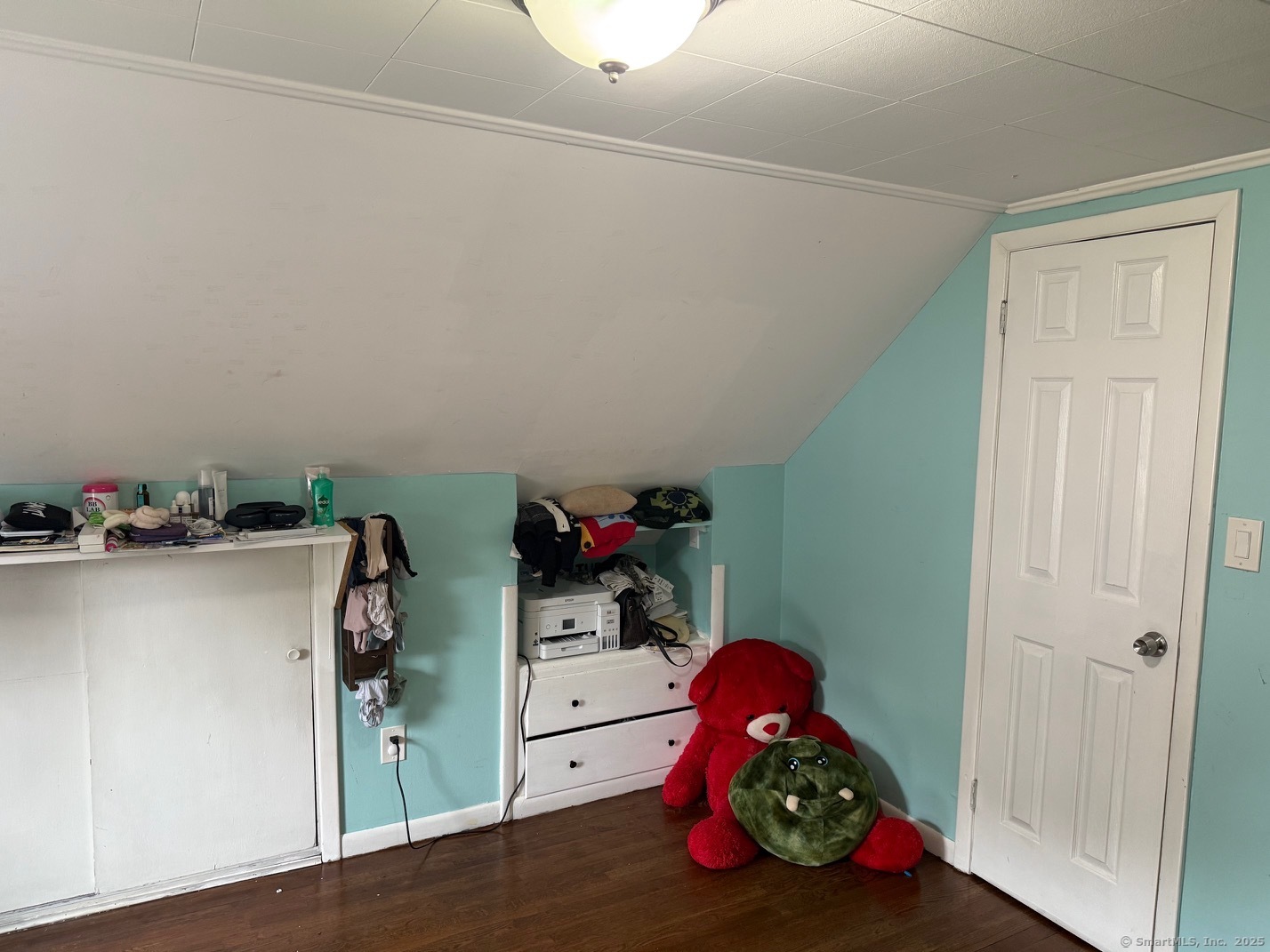 15 Edwards Street Bridgeport, CT 06606 - Photo 5 of 33 a bedroom with a bed and cabinets