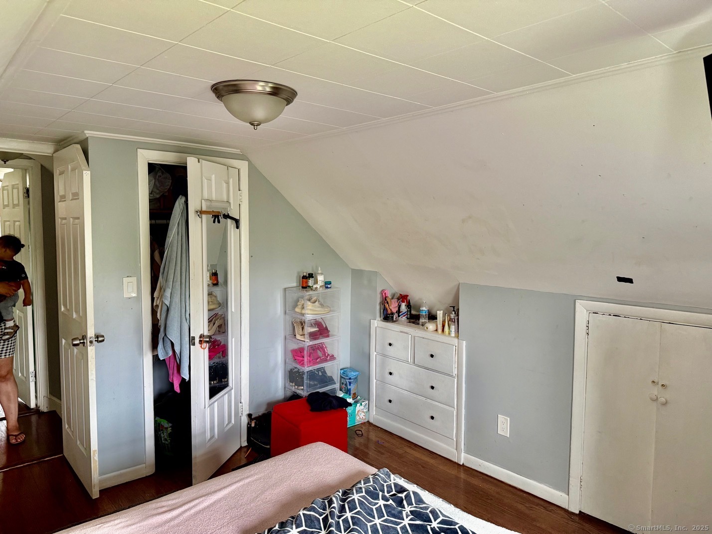 15 Edwards Street Bridgeport, CT 06606 - Photo 7 of 33 a view of walk in closet with clothes and shoes