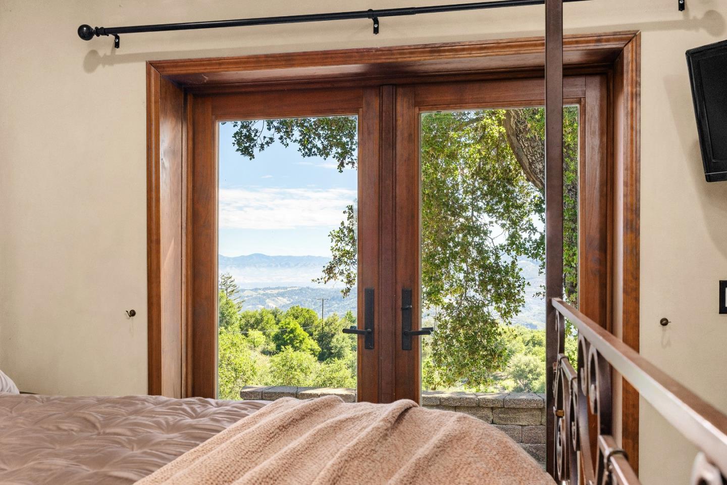 19375 Montevina Road Los Gatos, CA 95033 - Photo 13 of 36 a bedroom with a bed and balcony view
