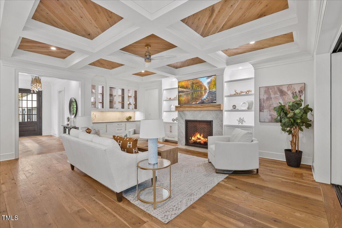 2120 Kipawa Street Raleigh, NC 27607 - Photo 11 of 77 a living room with furniture a fireplace and a potted plant