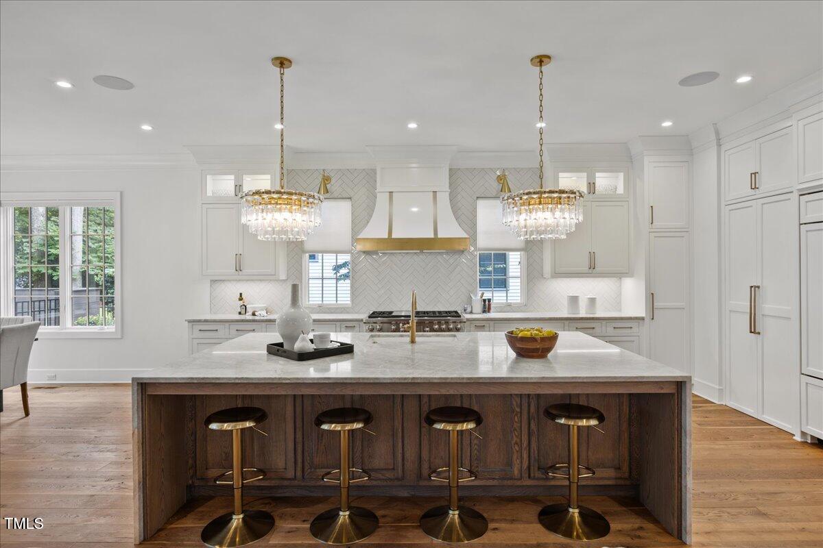 2120 Kipawa Street Raleigh, NC 27607 - Photo 16 of 77 a kitchen with a sink cabinets and window